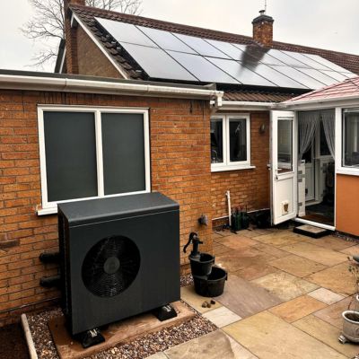 Solar panels and air source heat pump working together on a UK Eco Energy Solutions installation
