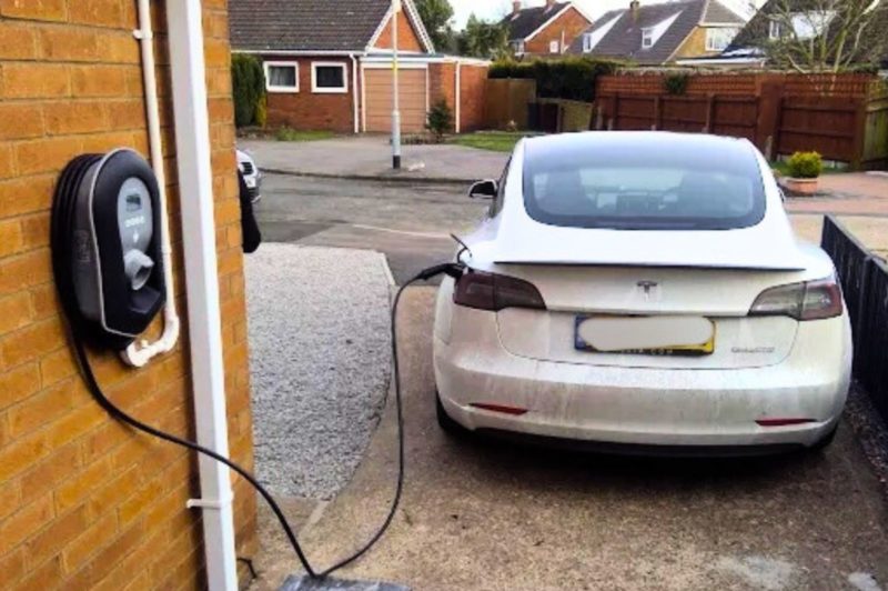 EV charger installed on garage and powered by solar panels in Lincolnshire